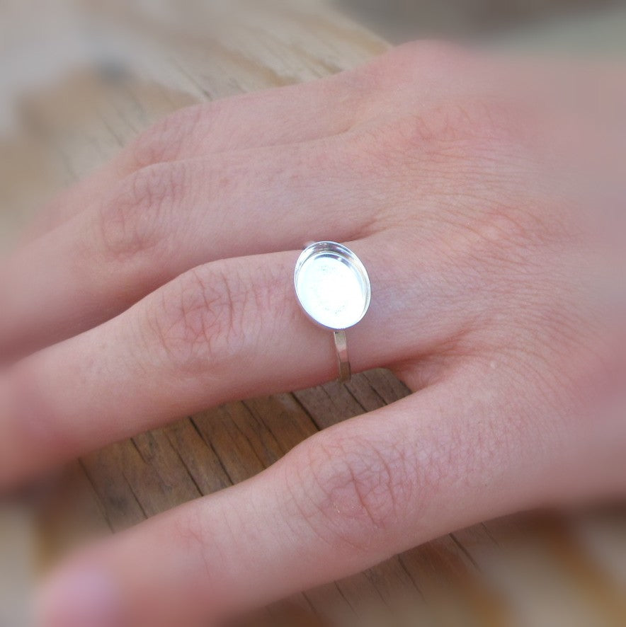 side oval bezel cup ring setting